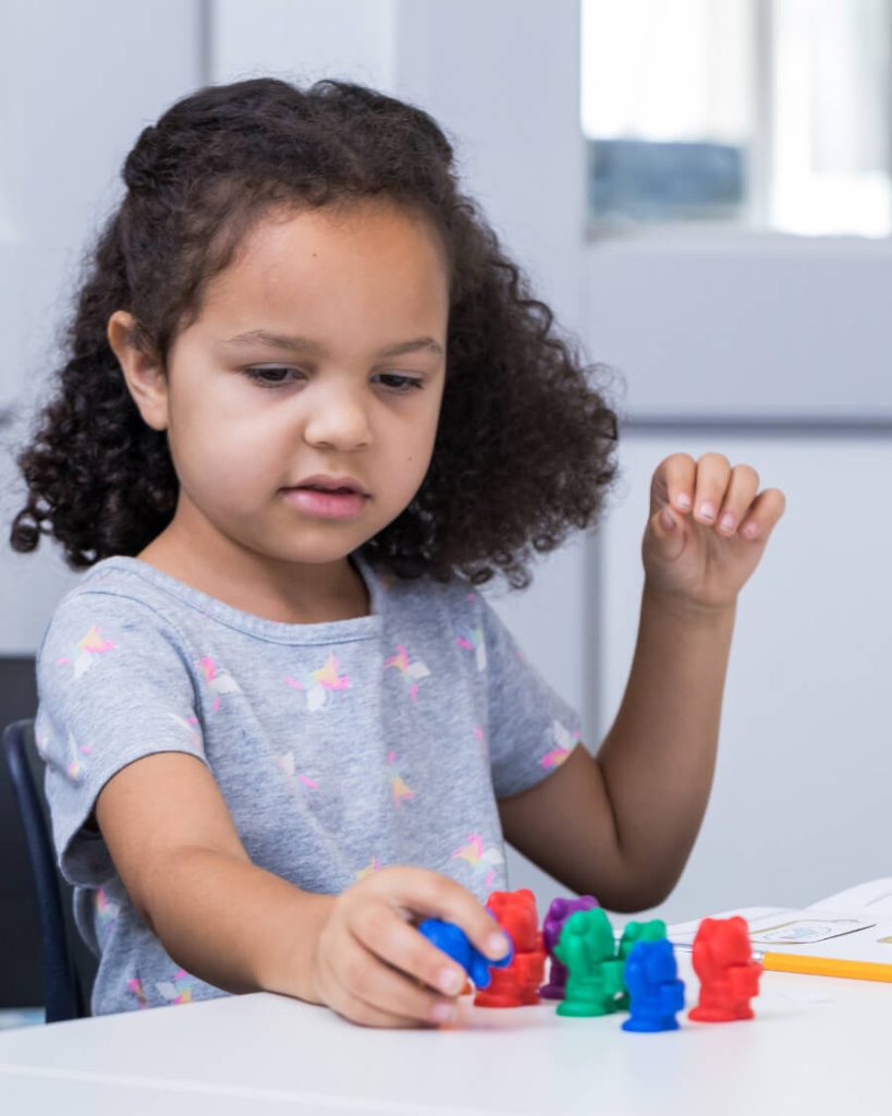 Little girl completing math challenge