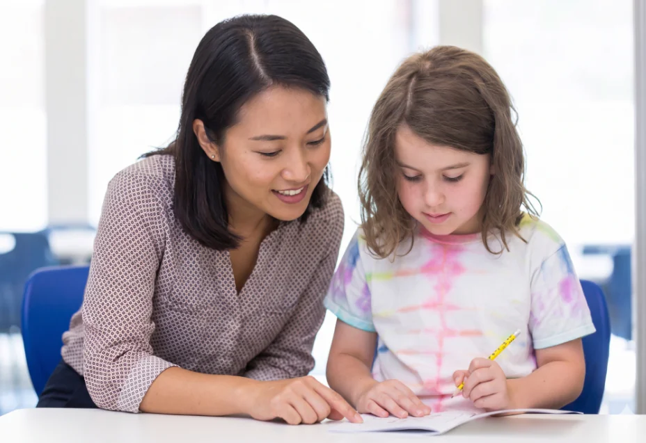 Child happily engaged in a Singapore Math learning activity – illustrating SAM's hands-on math enrichment approach